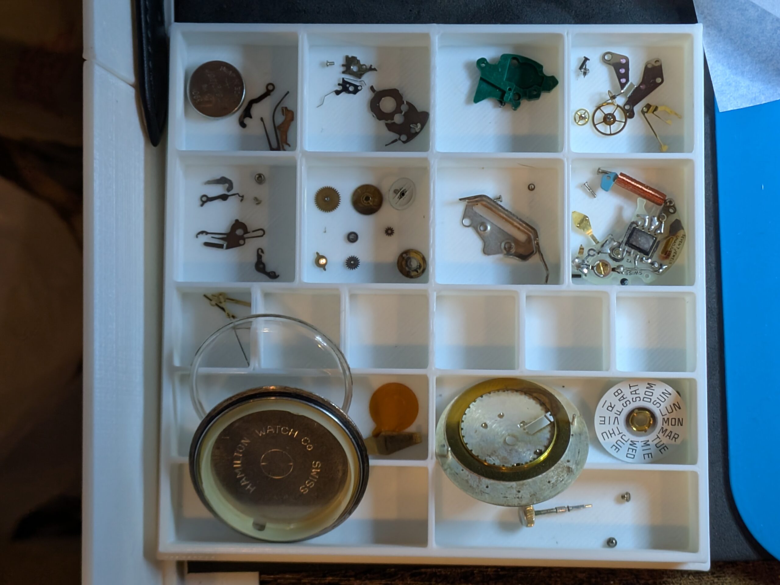 Box compartments of watch pieces.